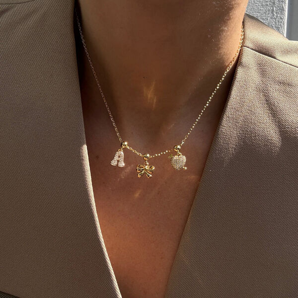 Bow Charm, gold, WHO IS SHE